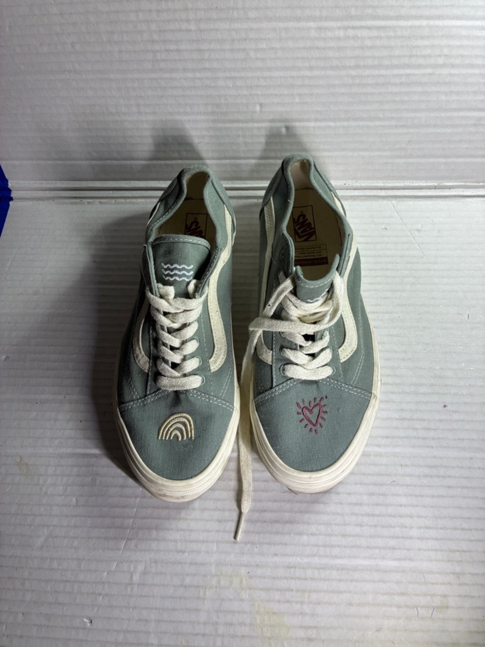 Vans low-top sneakers in sage green with cream accents and stitched details USED